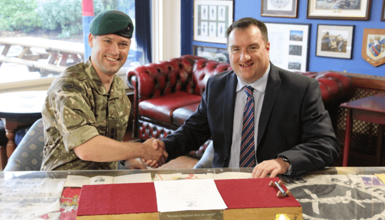 Dave Smith Shaking Hands With A Member Of The Armed Forces Covenant