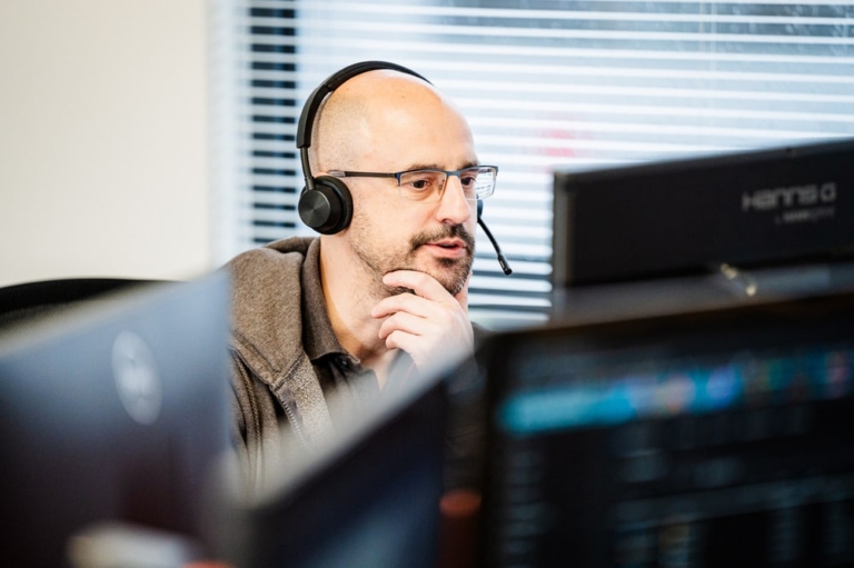 a man answering the phone discussing telephony services