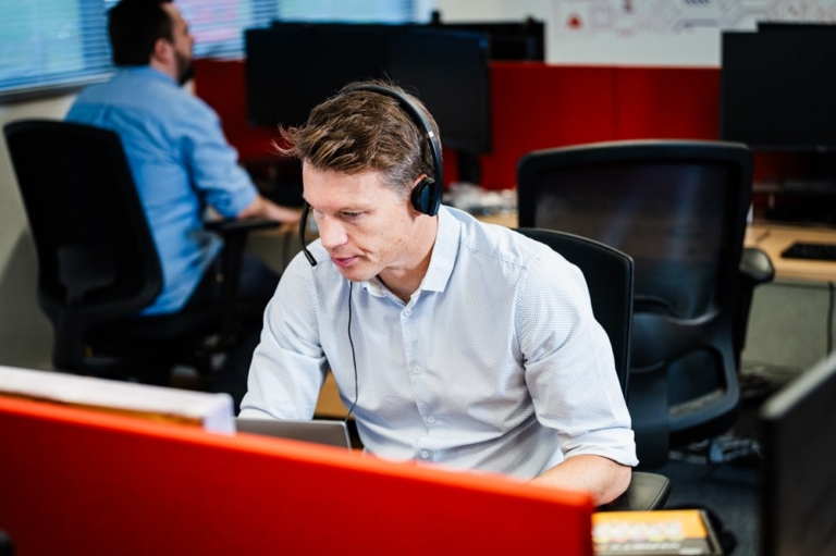 An acronyms employee working on their computer