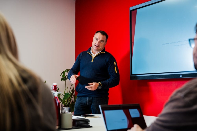 an acronyms employee delivering a presentation