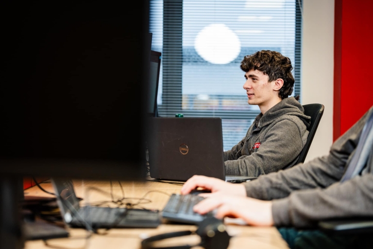 a man typing on his computer providing internet connectivity services