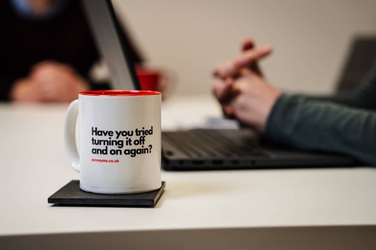 a close up view of a mug on a desk